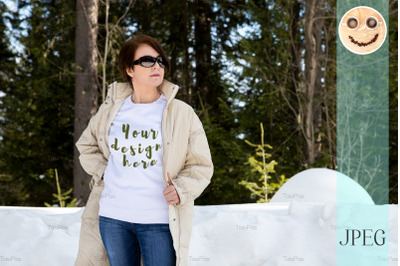 White sweatshirt mockup of a woman in beige coat.