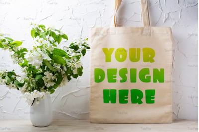 Rustic tote bag mockup with  flowering apple tree branch