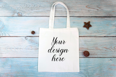White tote bag mockup on a wooden background. Rustic Farmhouse.