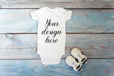 Baby Bodysuit mockup on a wooden background.