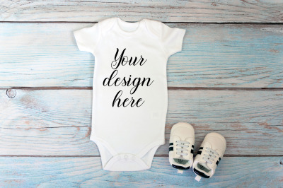 Baby Bodysuit mockup on a wooden background.