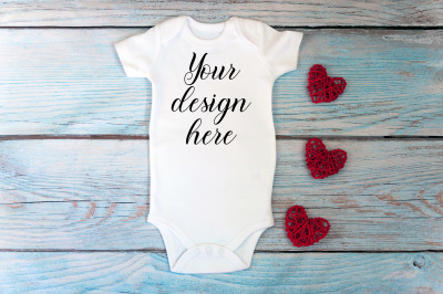 Valentines day Baby bodysuit mockup on a wooden background.