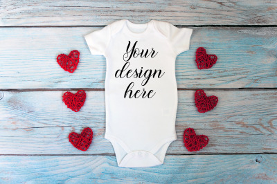 Valentines day Baby bodysuit mockup on a wooden background.