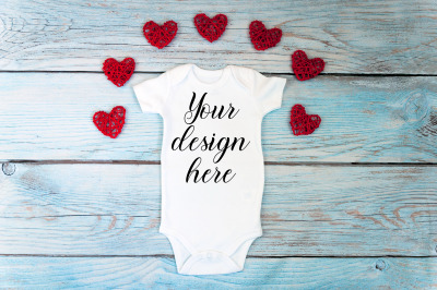 Valentines day Baby bodysuit mockup on a wooden background.