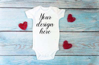 Valentines day Baby bodysuit mockup on a wooden background.