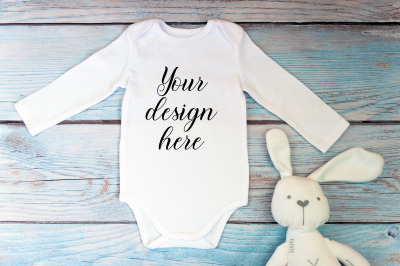 Bodysuit Mockup with long sleeves on a wooden background.