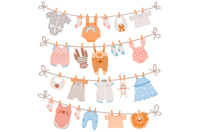 Baby clothes on rope. Newborn children apparel, socks, dress and toys