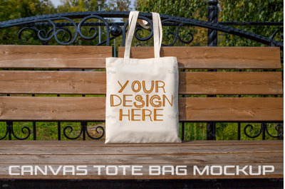 Rustic tote bag on the park bench mockup.