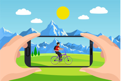 Photo on your phone. Hands hold smartphone, man ride on bicycle on gra