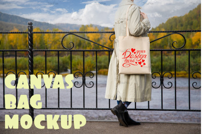 Woman in beige trench holding tote bag mockup