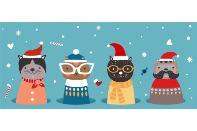 Christmas cats in hole. Kitten in winter clothes&2C; santa hat and scarfs