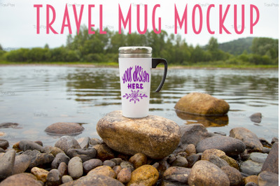 Travel mug mockup on river stone.
