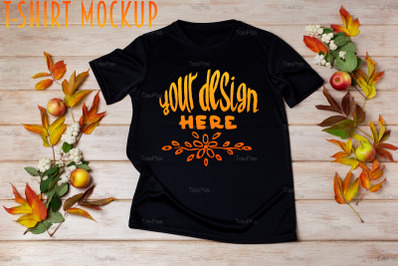 Unisex black T-shirt mockup with snowberry and fall leaves.