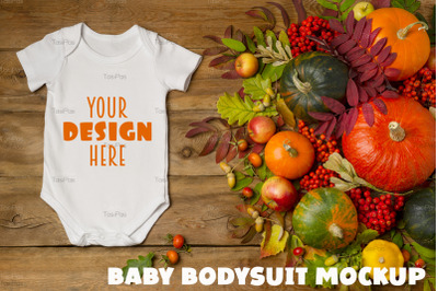 White baby short sleeve bodysuit mockup with apples and rowanberry.