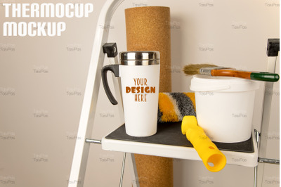 White travel mug mockup with home repair brush.