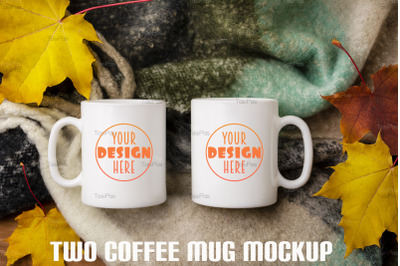Two white coffee mug mockup with woolen scarf and fall leaves.