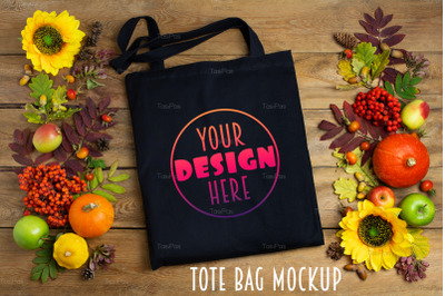 Black tote bag mockup with sunflowers and rowanberry.