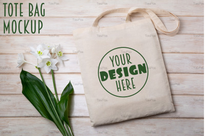 Rustic tote bag mockup with white lily.