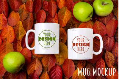 Two white coffee mug mockup with red leaves and apples background.