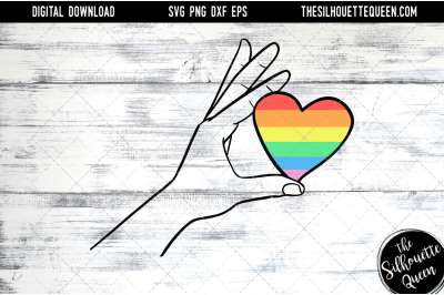 Hand Sketched hand holding rainbow heart
