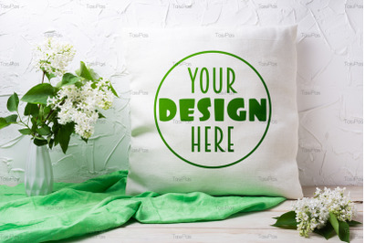 Pillow mockup with white lilac in the vase.