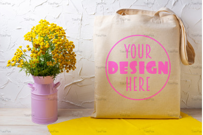 Tote bag mockup with yellow flowers