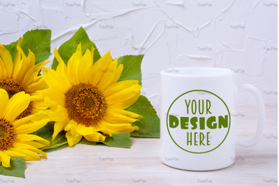 White coffee mug mockup with sunflowers bouquet.