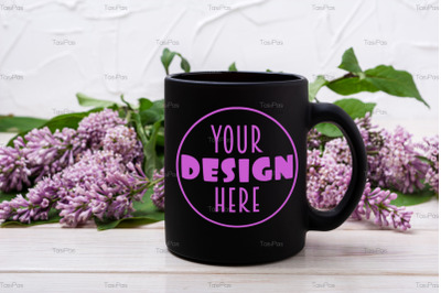 Black coffee mug mockup with lilac branch.