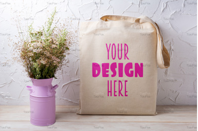 Rustic tote bag mockup with wild grass in the pink can.