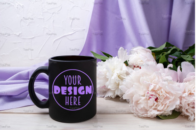 Black coffee mug mockup with pink peony and lilac scarf.