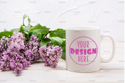 White coffee mug mockup with beautiful lilac bouquet.
