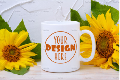 White coffee mug mockup with two yellow sunflowers.