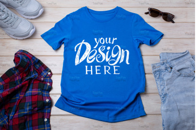 Unisex blue T-shirt mockup with trainers and jeans.