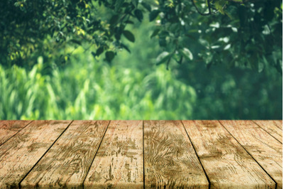 Empty Wooden Deck Table Old Rustic Plank with Foliage Bokeh Background