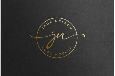 Debossed Feminine Gold Foil Logo Mockup on Black Paper