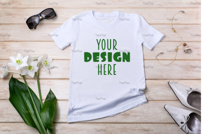Women white T-shirt mockup with lily flowers, green leaves.