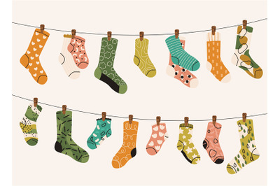 Socks on rope. Cartoon dry socks on textile cord, knitted wool fabric