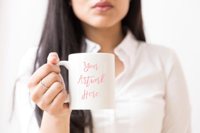 Woman holding  blank mug mockup