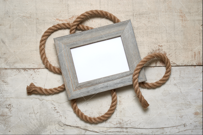 r-frame-with-rope-on-rustic-white-barn-wood-background