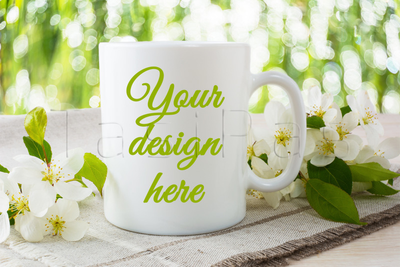 white-coffee-mug-mockup-with-blossoming-apple-tree-branch