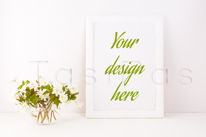 white-frame-mockup-with-rue-anemone-flowers