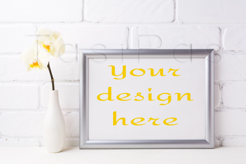 silver-landscape-frame-mockup-with-soft-yellow-orchid-in-vase
