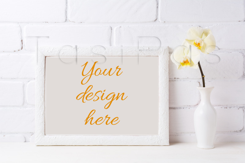 white-frame-mockup-with-soft-yellow-orchid-in-vase