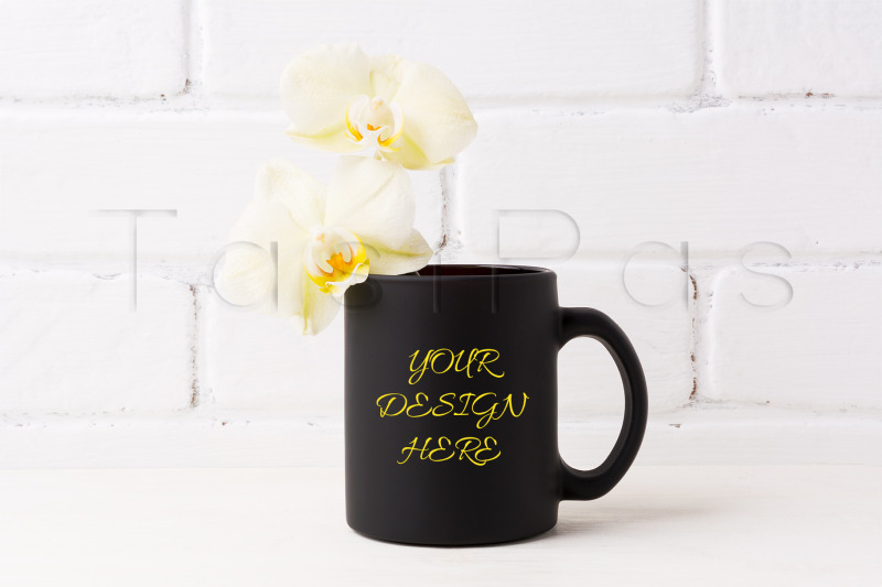 black-coffee-mug-mockup-with-soft-yellow-orchid