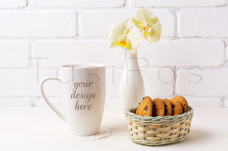 white-coffee-cappuccino-mug-mockup-with-soft-yellow-orchid-in-vase-and