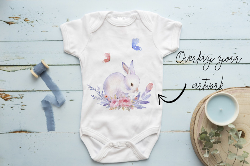 babygrow-romper-suit-onsie-mockup-with-blue-wooden-background