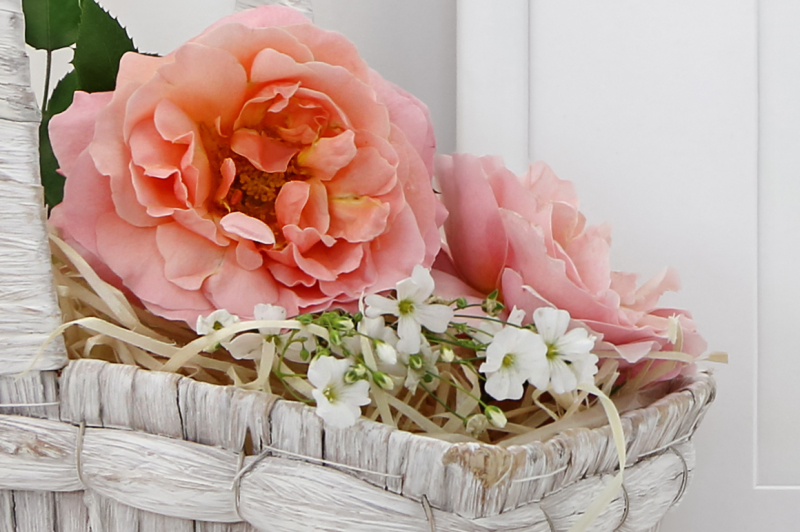 blank-picture-frame-mockup-with-a-basket-of-roses