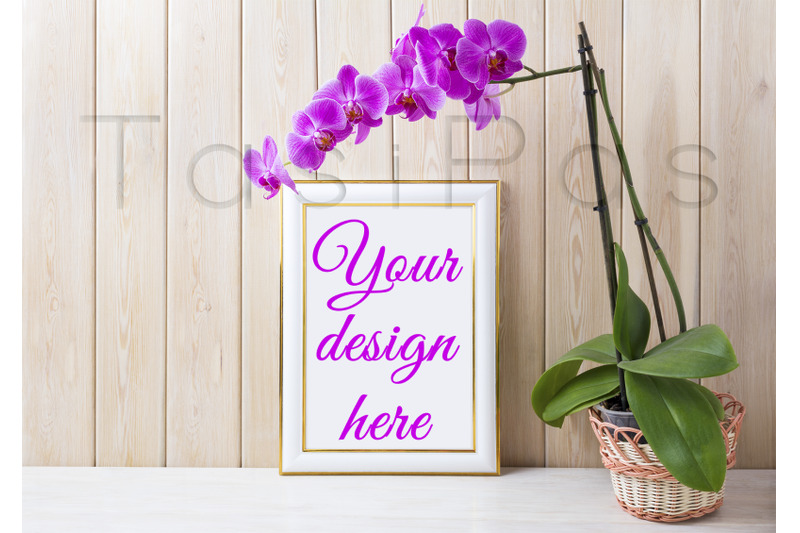 gold-decorated-frame-mockup-with-purple-orchid-in-wicker-basket