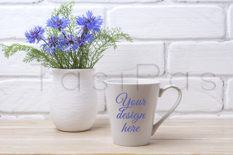white-coffee-latte-mug-mockup-with-cornflower-in-rustic-vase