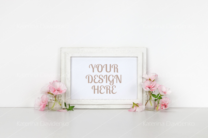 horizontal-wooden-frame-mockup-little-bottles-with-pink-flowers-whit